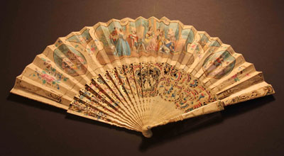 Folding fan with a central carved scene